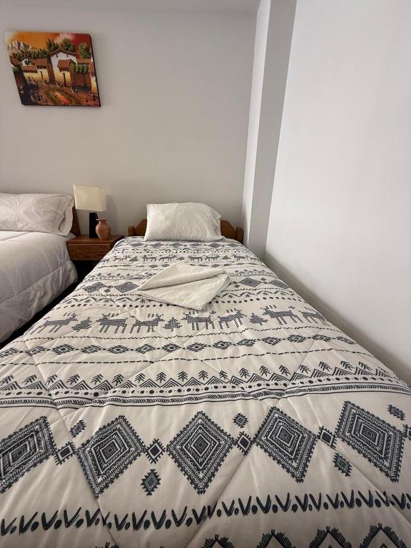 Postel nebo postele na pokoji v ubytování cusco terra inn