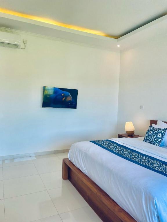 Postel nebo postele na pokoji v ubytování Nirana Ubud