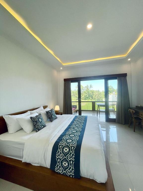 Postel nebo postele na pokoji v ubytování Nirana Ubud