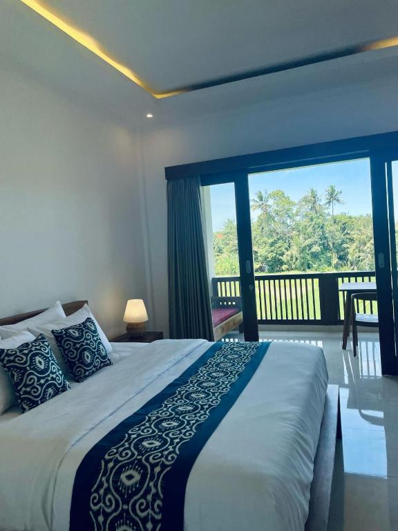 Postel nebo postele na pokoji v ubytování Nirana Ubud