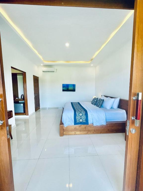 Postel nebo postele na pokoji v ubytování Nirana Ubud