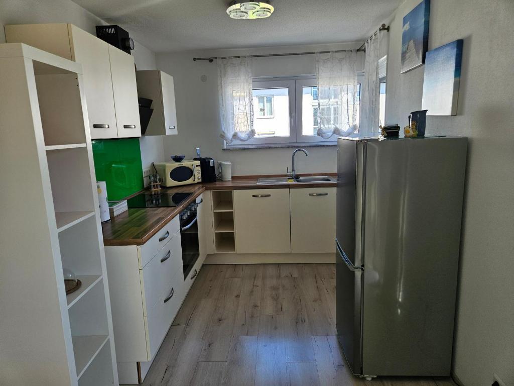 Kuchyň nebo kuchyňský kout v ubytování Jollen Apartments
