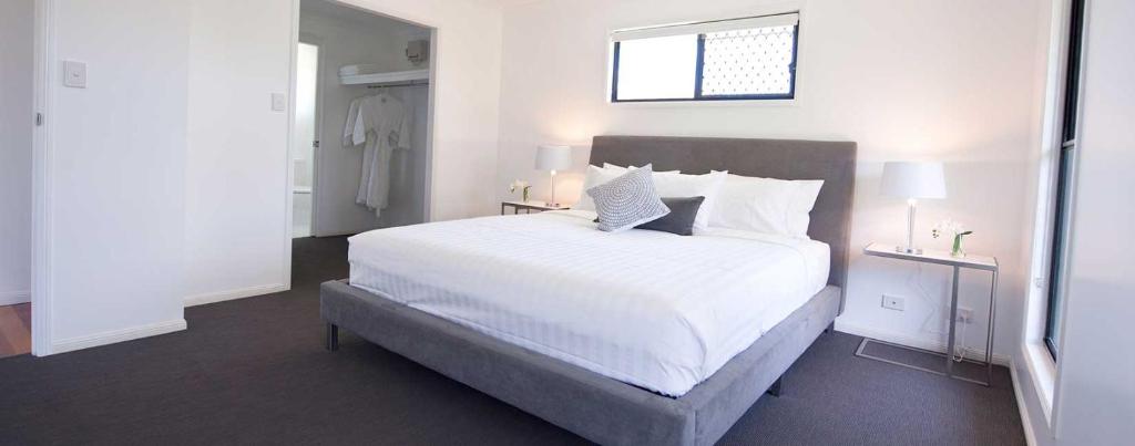 Letto o letti in una camera di Sanctuary by Sirromet