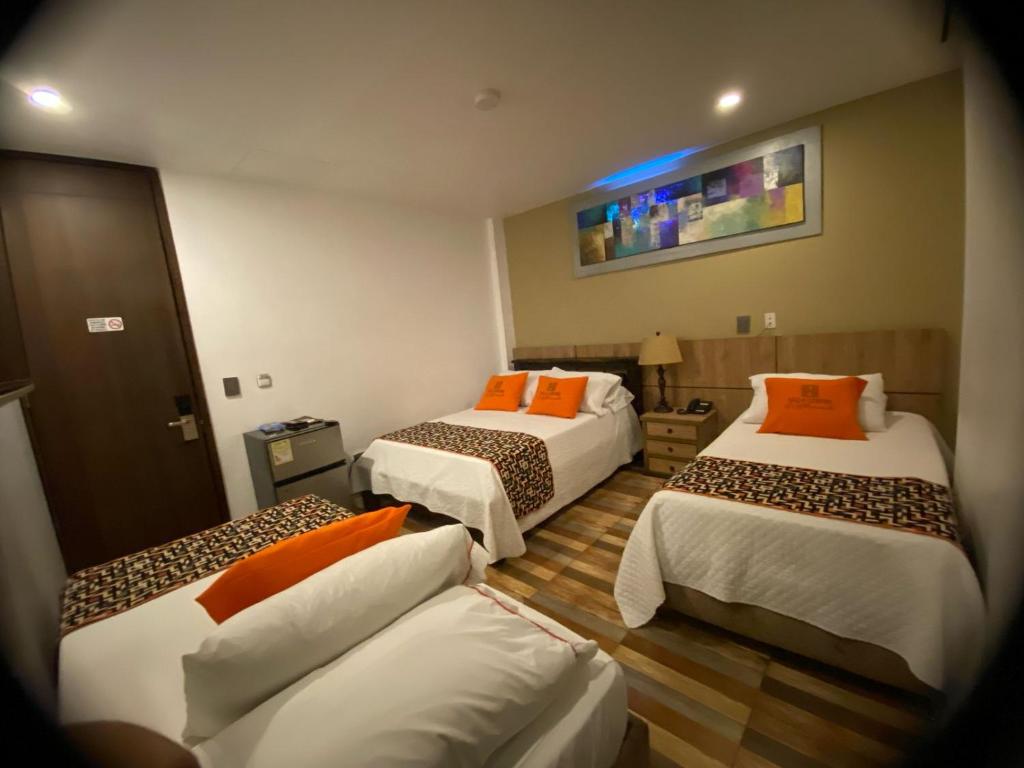 Postel nebo postele na pokoji v ubytování Hotel Ucla Center