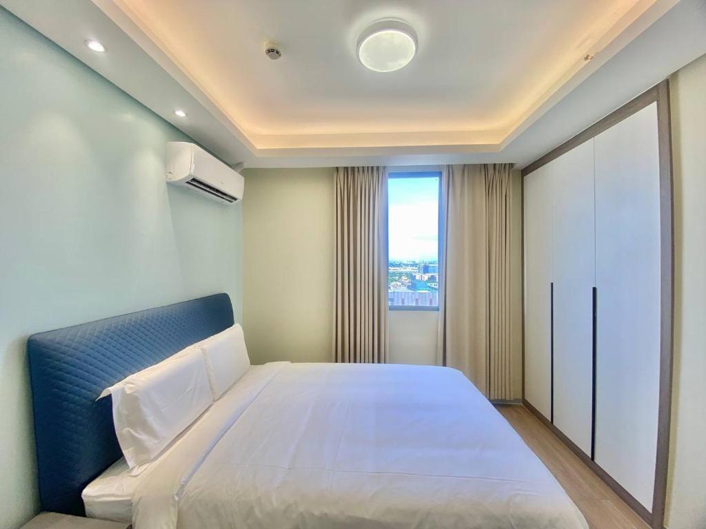 Voodi või voodid majutusasutuse City Center Executive Hotel-Near Manila Airport and PITX toas