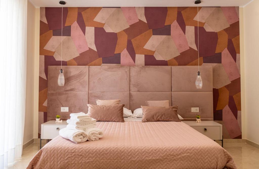 Ένα ή περισσότερα κρεβάτια σε δωμάτιο στο Amabile Luxury Rooms