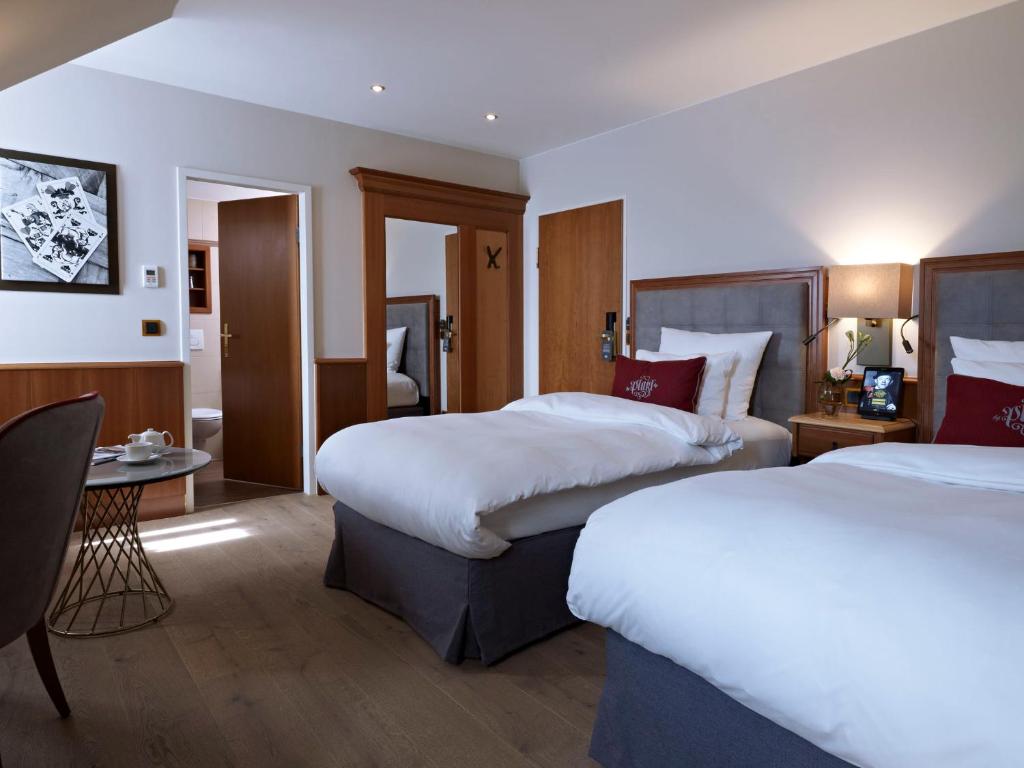 Postel nebo postele na pokoji v ubytování Platzl Hotel - Superior