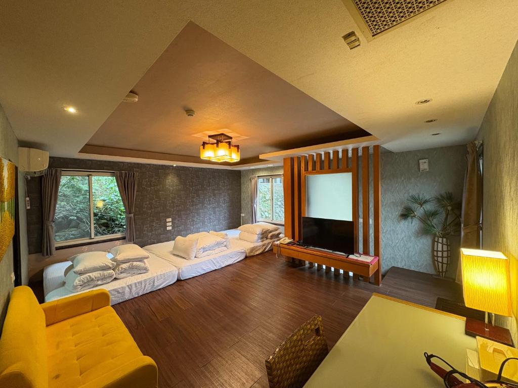 Postel nebo postele na pokoji v ubytování Ci Meng Rou Resort Villa