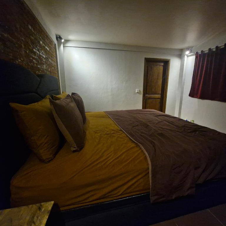 Postel nebo postele na pokoji v ubytování Lala Salama Backpacker