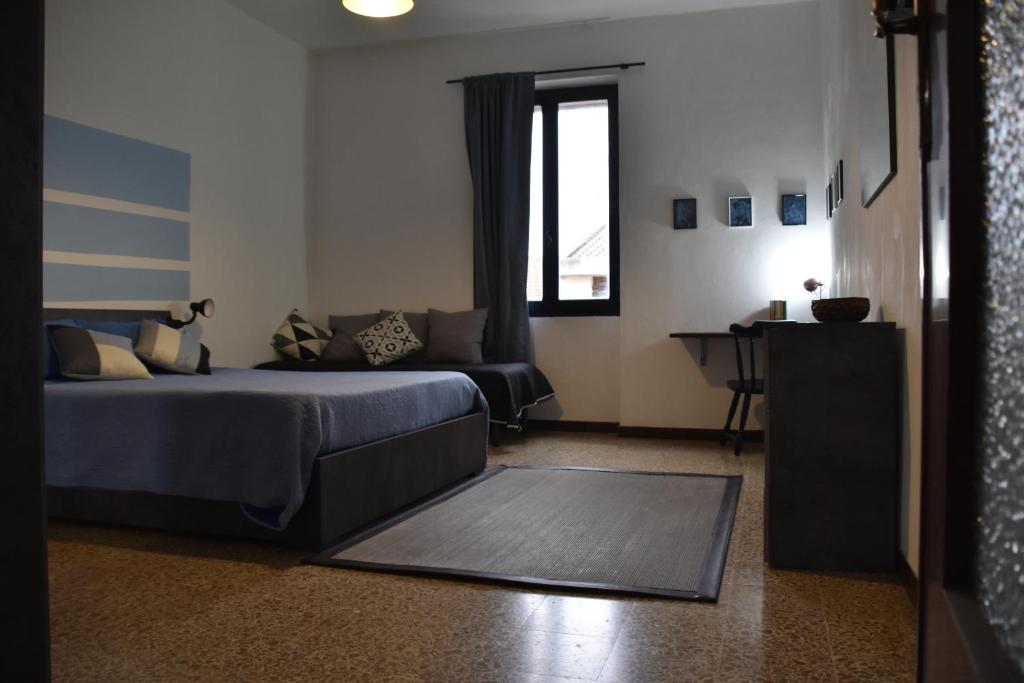 Postel nebo postele na pokoji v ubytování Donpedro's home