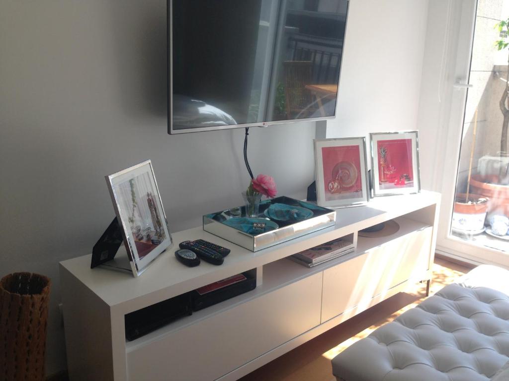 En tv och/eller ett underhållningssystem på Luxury Apartment Recoleta