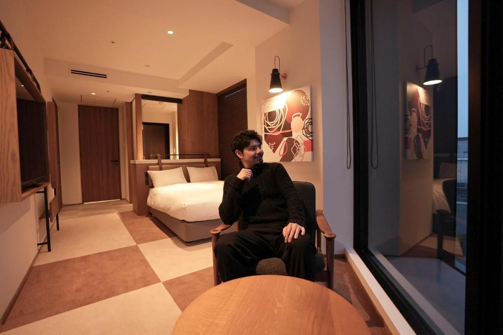 Postel nebo postele na pokoji v ubytování CINQS Hotel