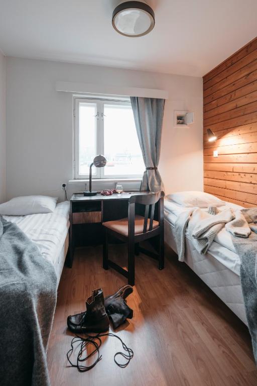Postel nebo postele na pokoji v ubytování Lapland Hotels Kilpis