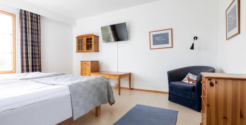 Postel nebo postele na pokoji v ubytování Lapland Hotels Kilpis