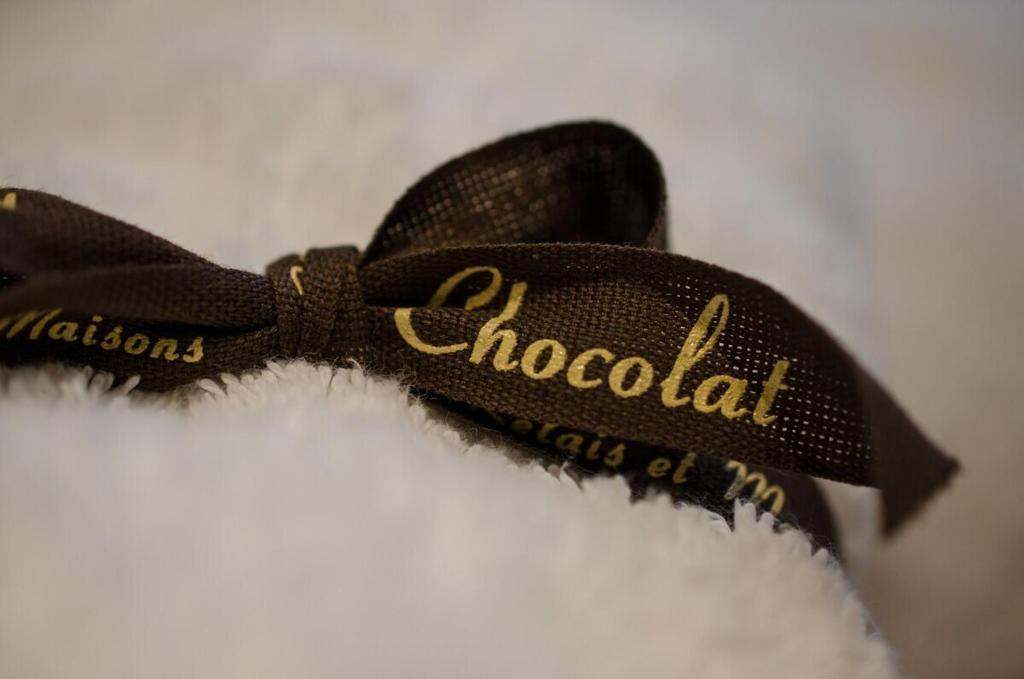Certifikát, hodnocení, plakát nebo jiný dokument vystavený v ubytování Chocolat L'Escale