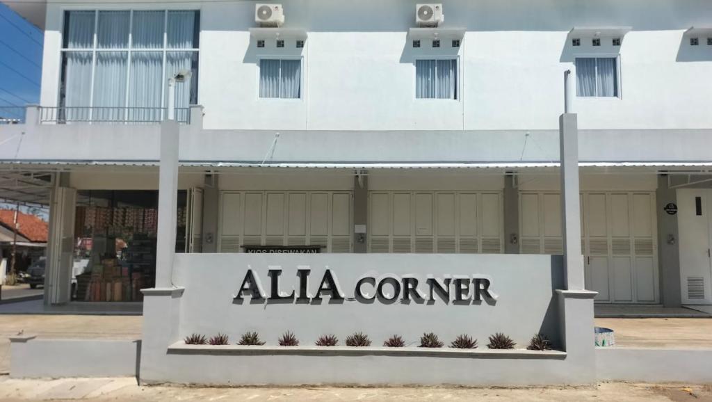 a building with a sign that reads alla corner at Alia Corner Homestay in Mandiraja