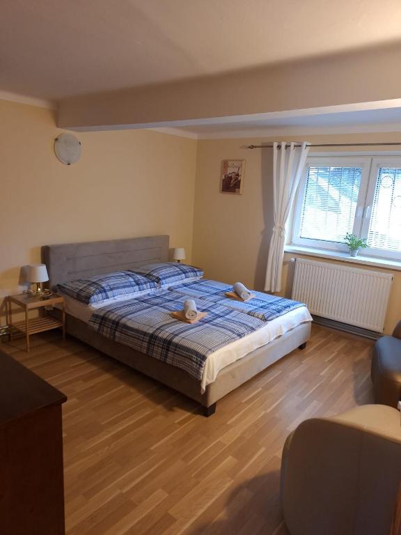 Postel nebo postele na pokoji v ubytování Star Apartments