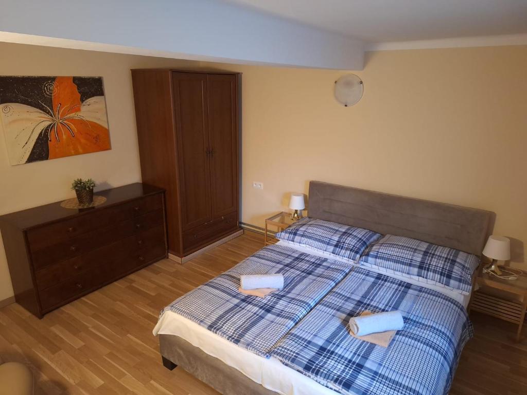 Postel nebo postele na pokoji v ubytování Star Apartments