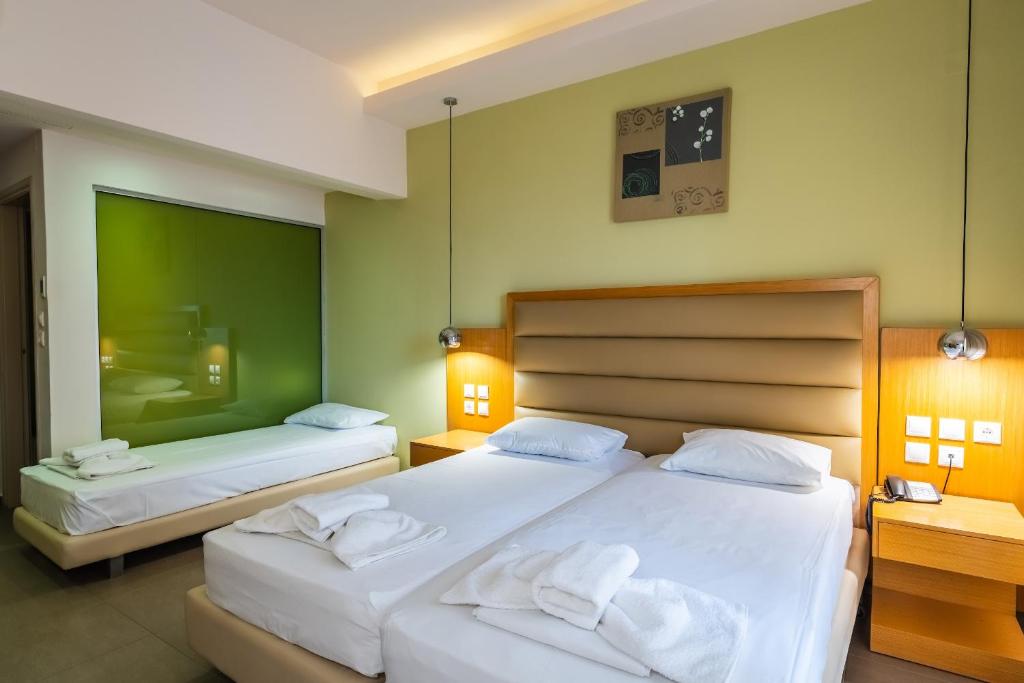 Postel nebo postele na pokoji v ubytování Pantheon Hotel