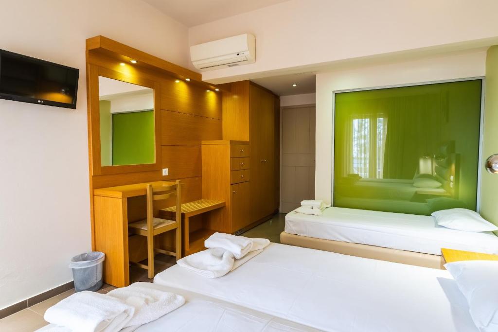 Postel nebo postele na pokoji v ubytování Pantheon Hotel