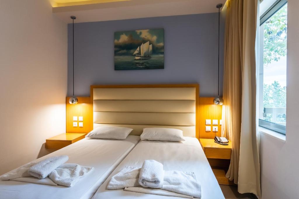 Postel nebo postele na pokoji v ubytování Pantheon Hotel