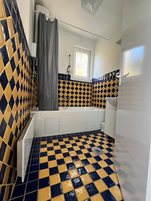 Łazienka w obiekcie Pellegrini Apartman