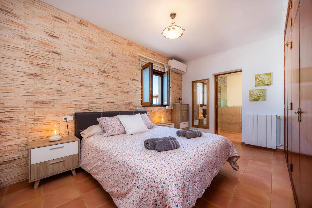 Postel nebo postele na pokoji v ubytování Villa Dos Estels