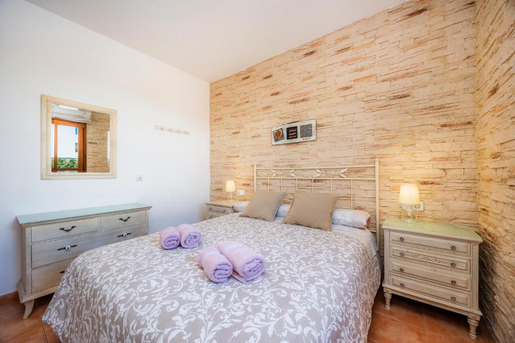 Postel nebo postele na pokoji v ubytování Villa Dos Estels