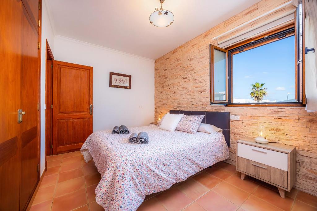 Postel nebo postele na pokoji v ubytování Villa Dos Estels