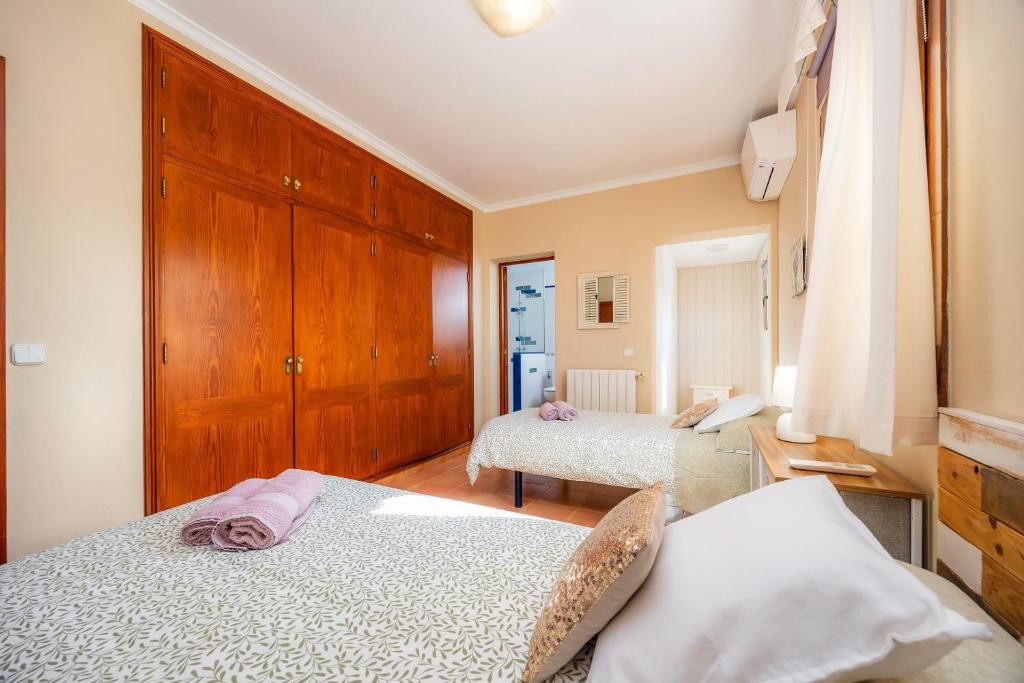 Postel nebo postele na pokoji v ubytování Villa Dos Estels