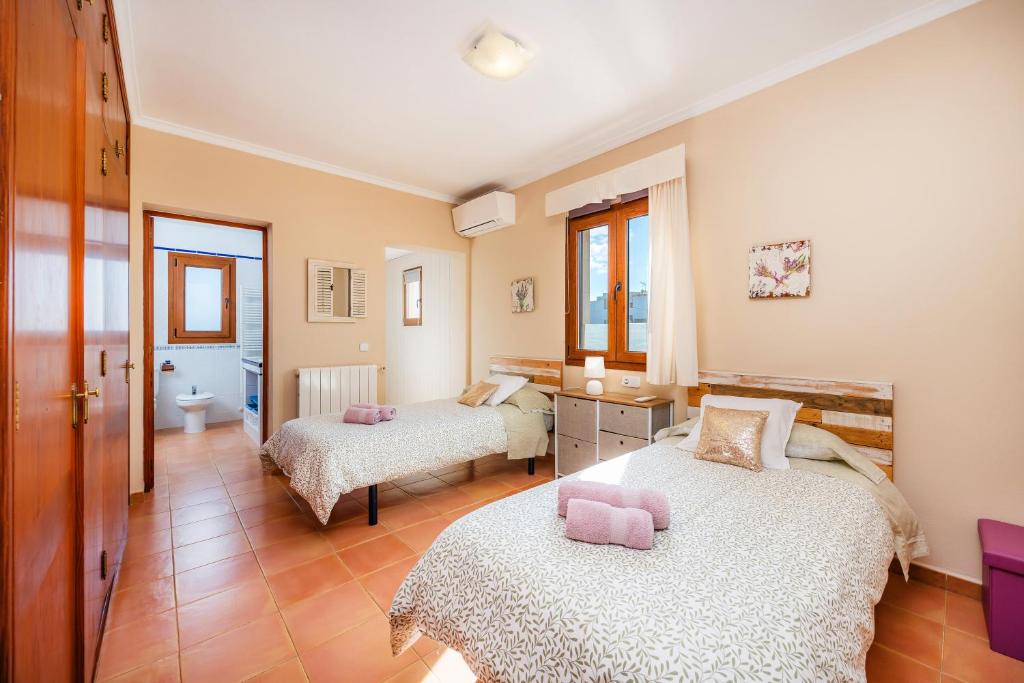 Postel nebo postele na pokoji v ubytování Villa Dos Estels