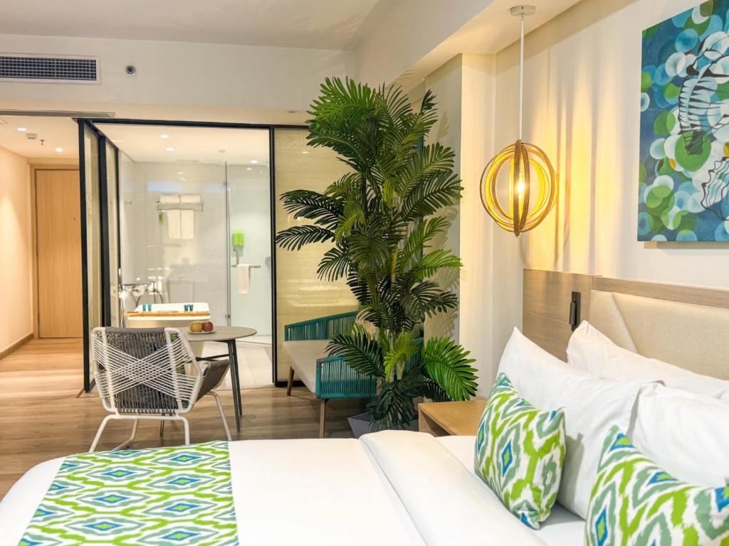 Postel nebo postele na pokoji v ubytování Lime Resort El Nido