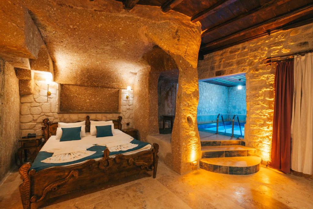 Ένα ή περισσότερα κρεβάτια σε δωμάτιο στο Cappatria Cave House