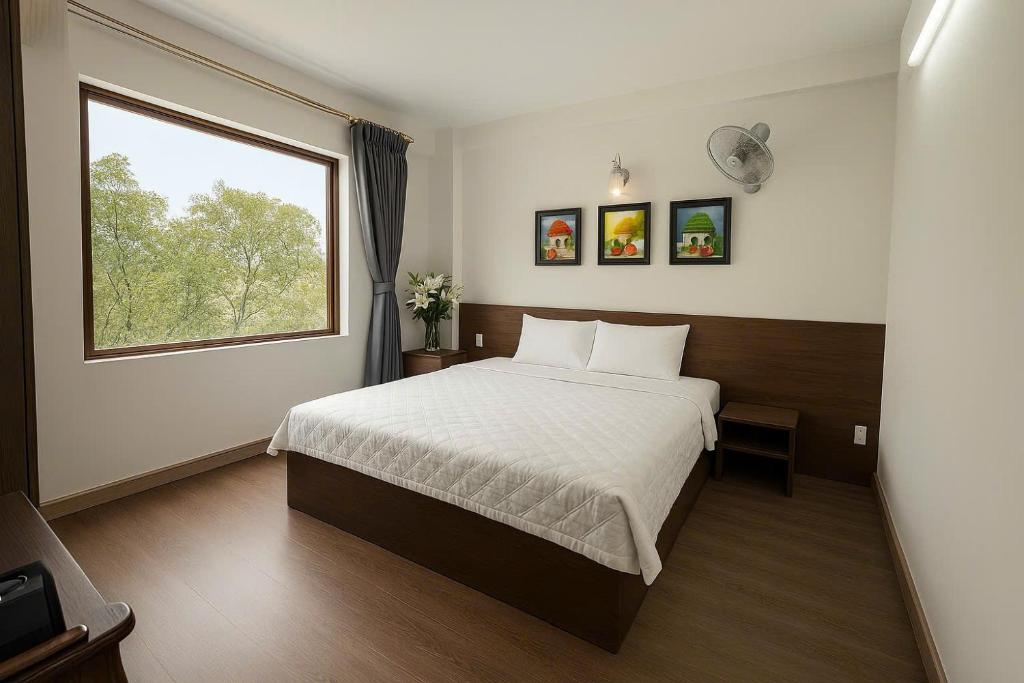 Postel nebo postele na pokoji v ubytování Noi Bai Sunflower Hotel