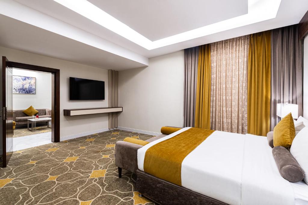 Postel nebo postele na pokoji v ubytování Garden Millennium Hotel