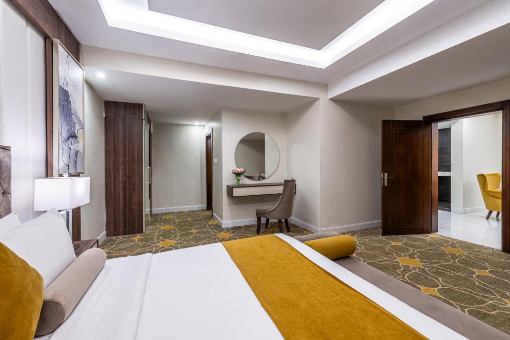 Postel nebo postele na pokoji v ubytování Garden Millennium Hotel