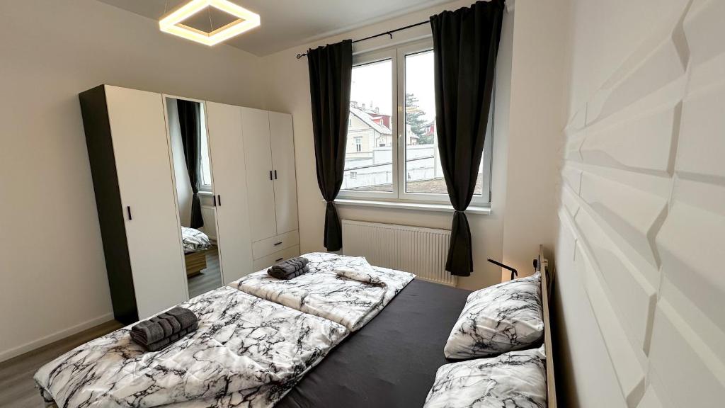 Postel nebo postele na pokoji v ubytování Villa Leopold - apartmánový dům