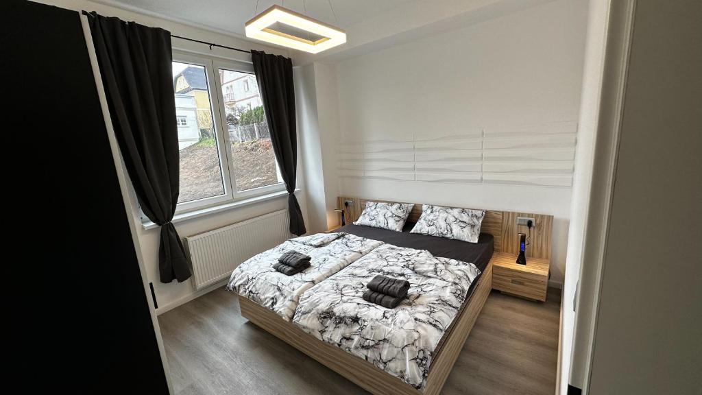 Postel nebo postele na pokoji v ubytování Villa Leopold - apartmánový dům