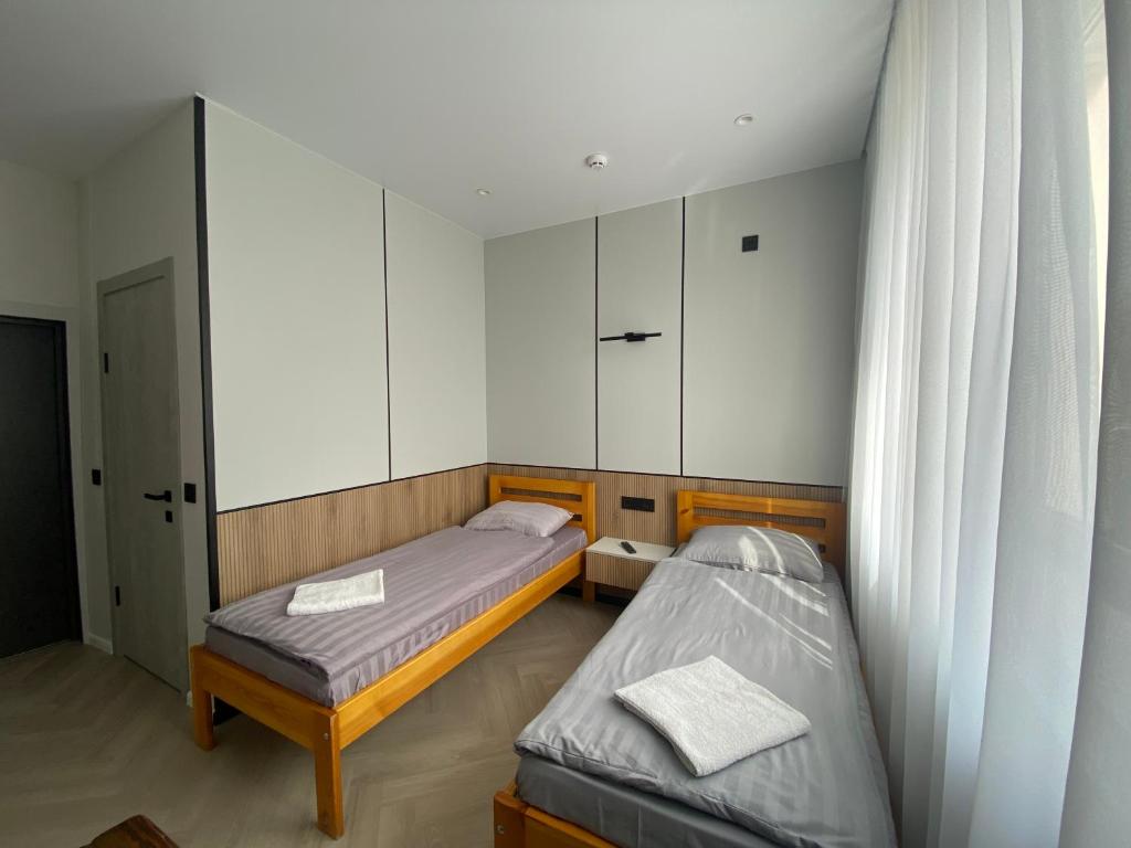 Postel nebo postele na pokoji v ubytování mini-hotel Neptun