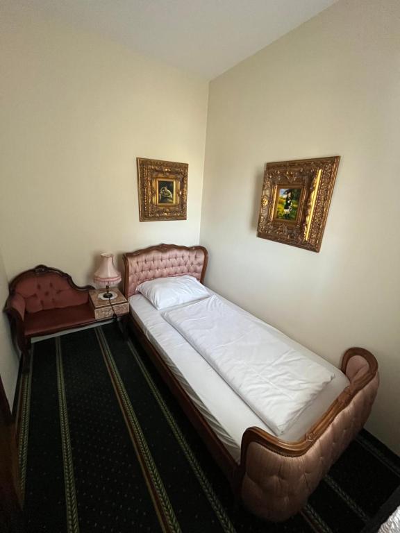 Postel nebo postele na pokoji v ubytování Hotel Razgorsek
