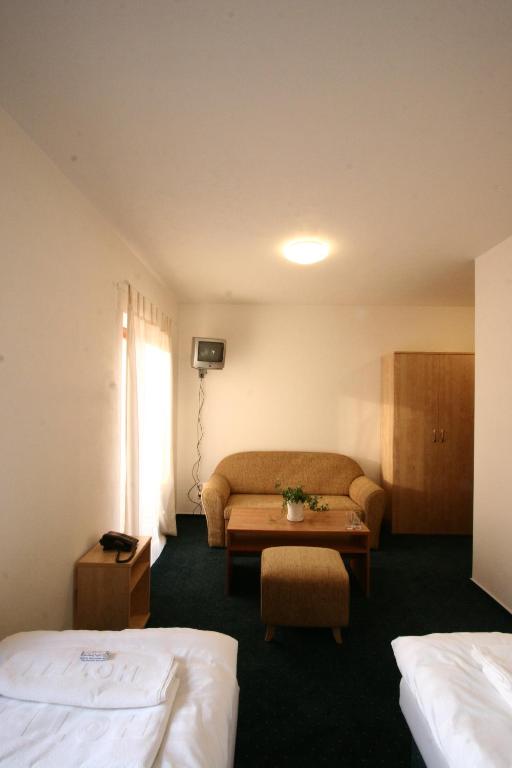 Postel nebo postele na pokoji v ubytování Hotel Panska Licha
