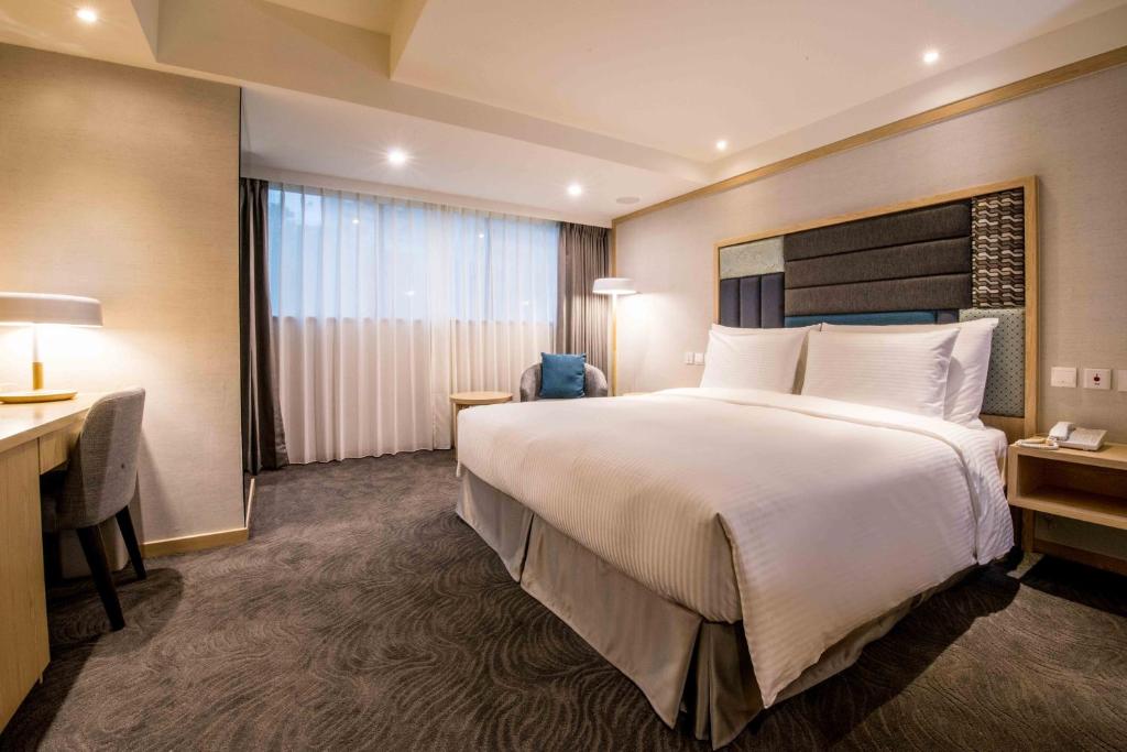 Postel nebo postele na pokoji v ubytování Sonnien Hotel