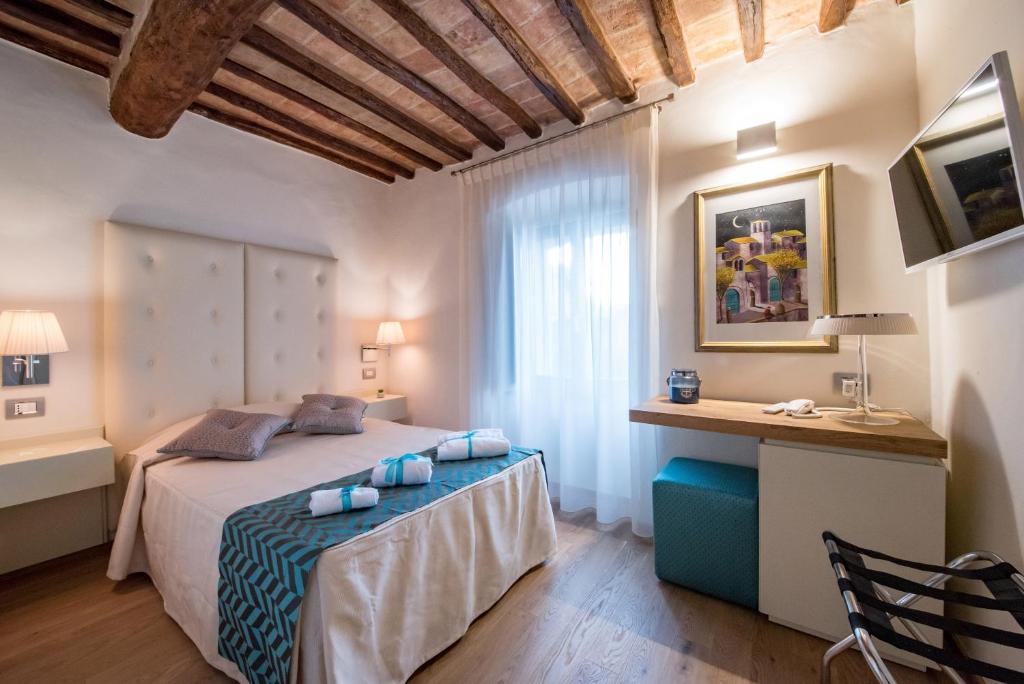 Postel nebo postele na pokoji v ubytování Hotel Il Palazzo