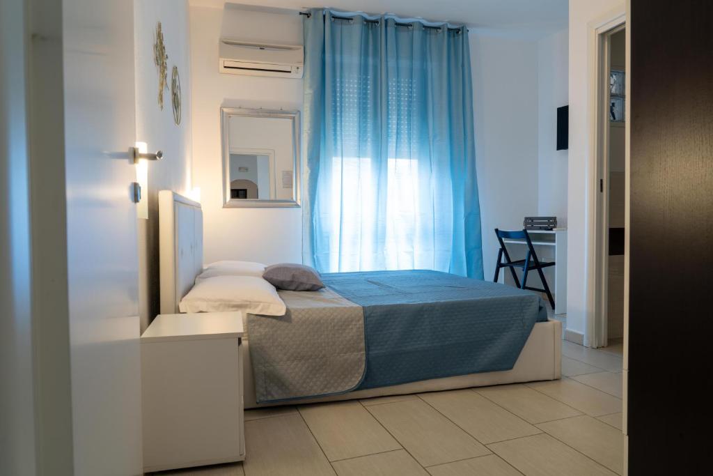 Postel nebo postele na pokoji v ubytování Eulalia Bnb Alghero