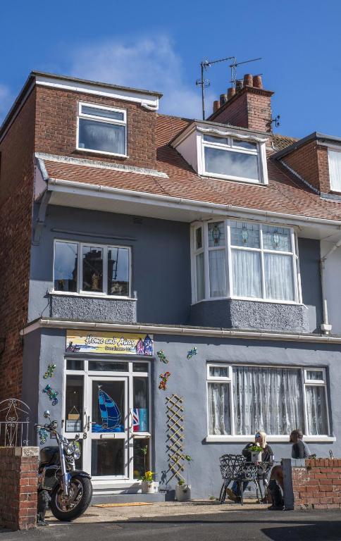 a building with a motorcycle parked in front of it at Home and Away near the Spa in Bridlington