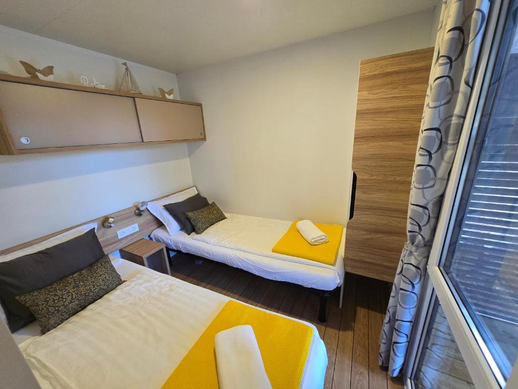 Postel nebo postele na pokoji v ubytování Mobile Home Itana Nr 127