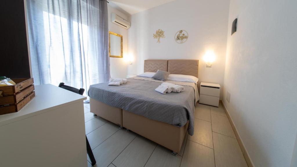 Postel nebo postele na pokoji v ubytování Eulalia Bnb Alghero