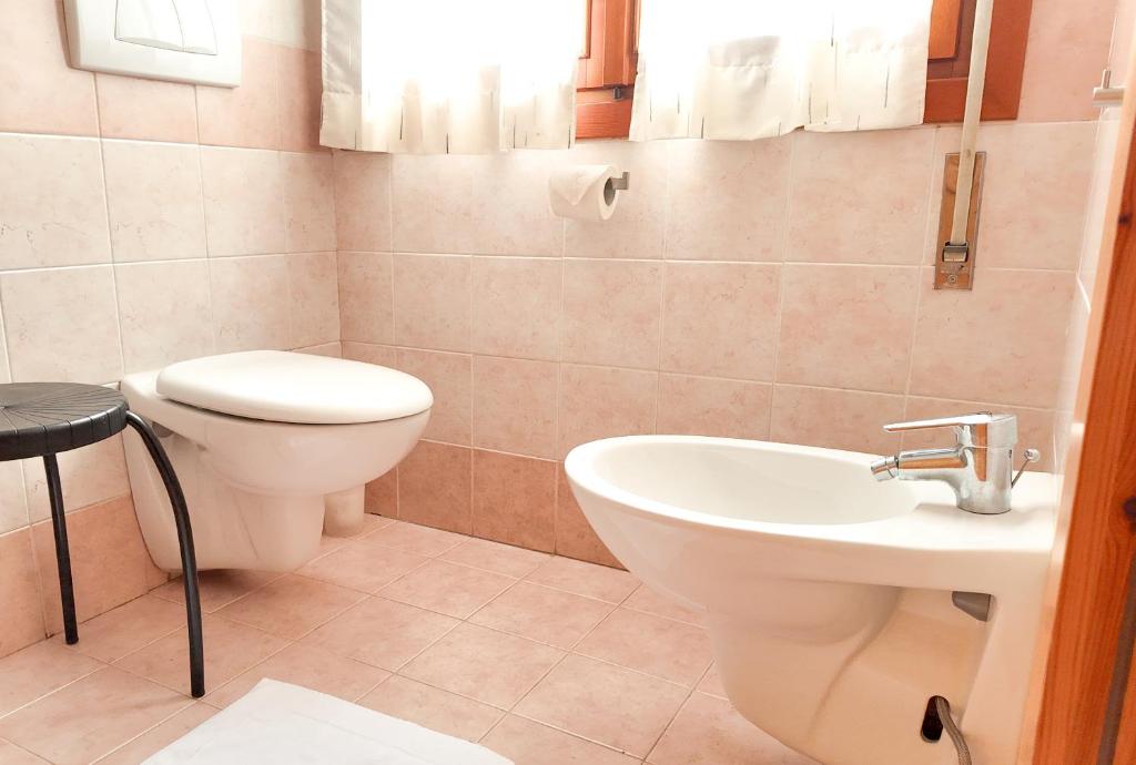 Koupelna v ubytování Albergo Dalla Mena