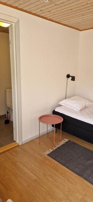 Postel nebo postele na pokoji v ubytování Grandgården