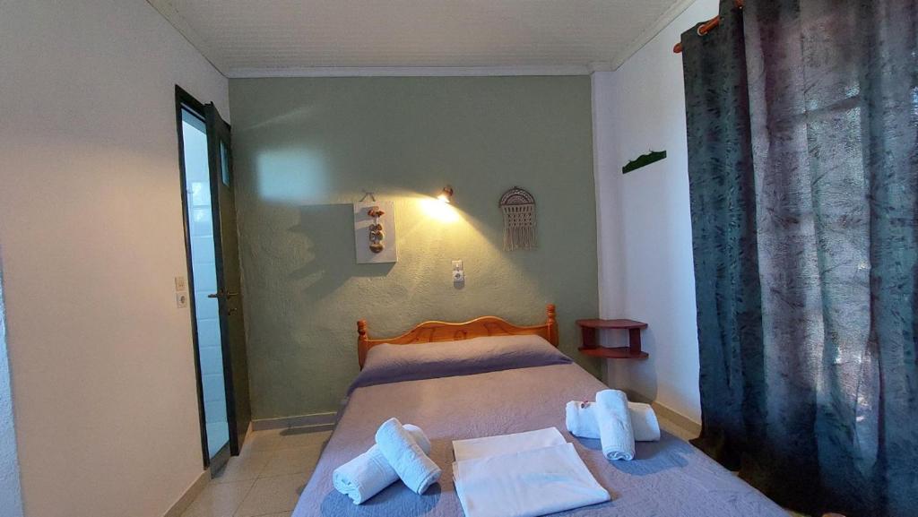 Postel nebo postele na pokoji v ubytování SunRiseStudiosPapanero